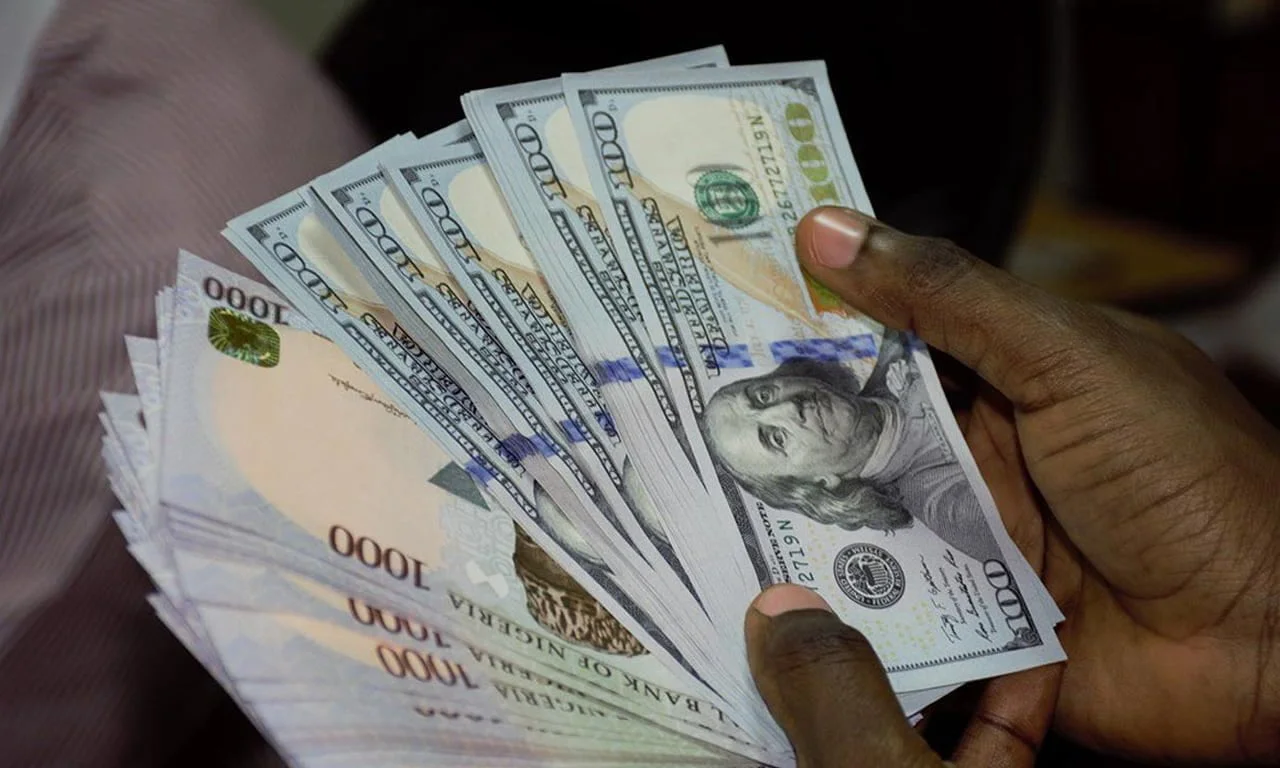 Naira drops against dollar at official, black markets amid spike in inflation