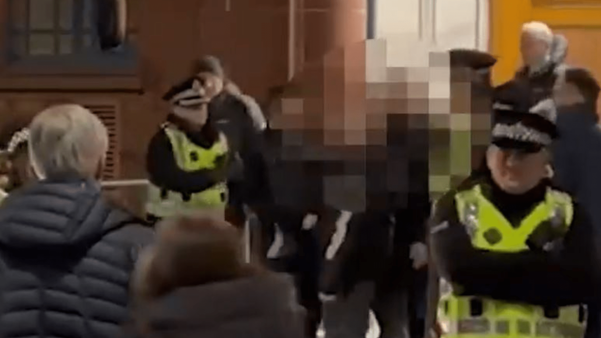 Watch shock moment Rangers fan is dragged away by police as he confronts Celtic staff member outside Ibrox main door