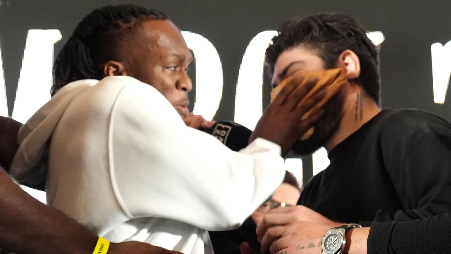 KSI sparks carnage on press conference stage after slapping Dillon Danis with a PANCAKE ahead of boxing grudge fight